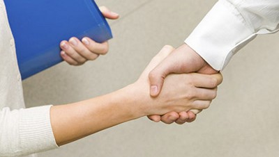 Image of partners handshake after signing contract